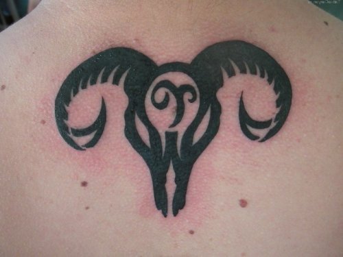 Black Tribal Aries Tattoo On Upperback