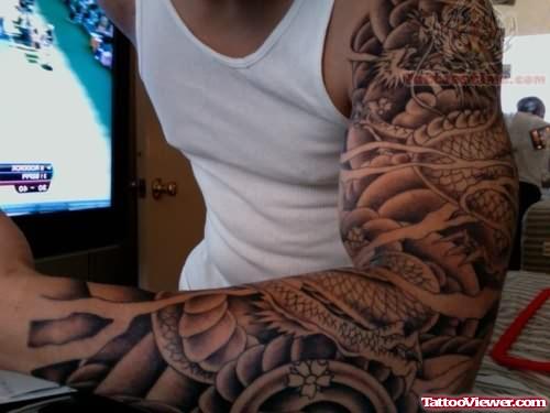 Grey Ink Left Arm Tattoo