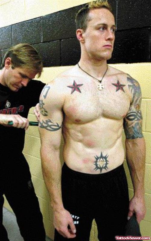 Red Nautical Stars And Tribal Tattoos On Arm