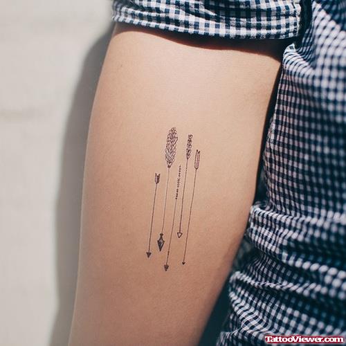 Grey Ink Arrows Tattoo On Arm