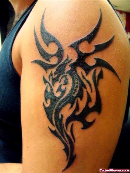Tribal Dragon Tattoo On Left Arm