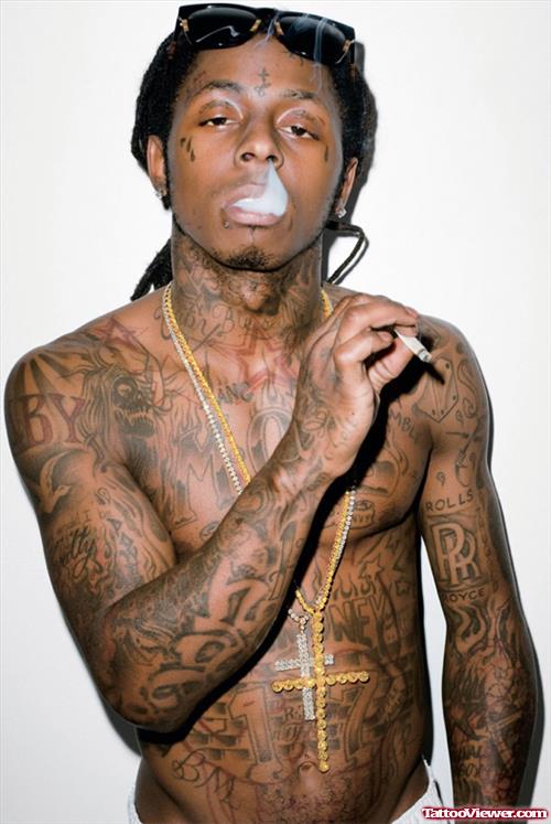 Grey Ink Tattoos On Lil Wayne Arms
