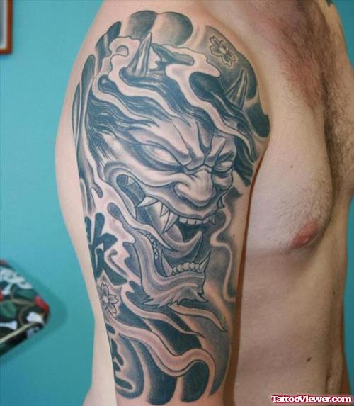 Grey Ink Hanya Mask Tattoo On Right Arm