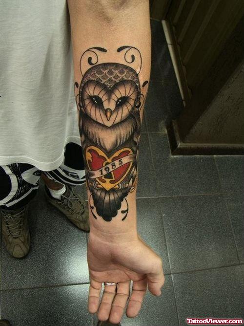 Grey Ink Owl And Red Heart Arm Tattoo
