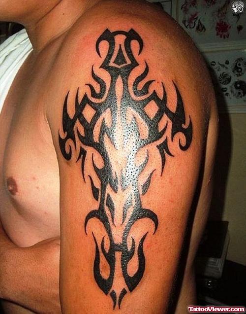 Flaming Tribal Cross Arm Tattoo