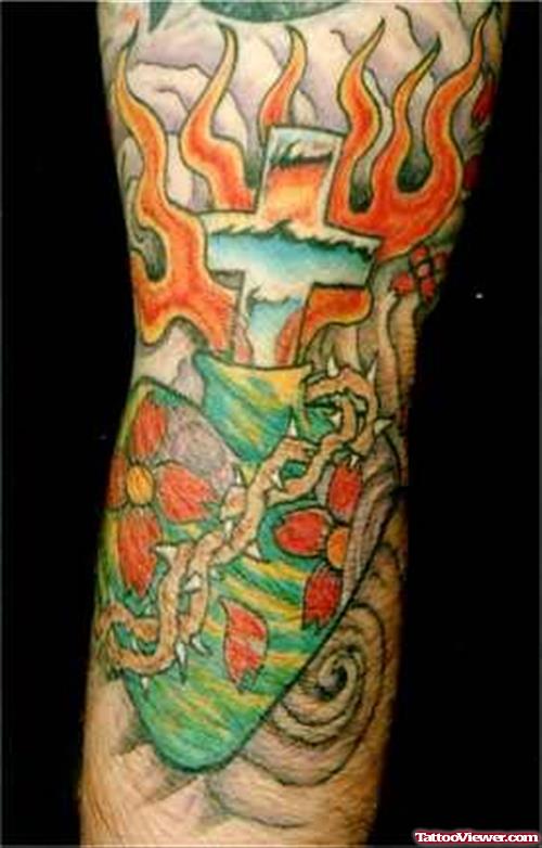 Burning Cross Tattoo On Arm