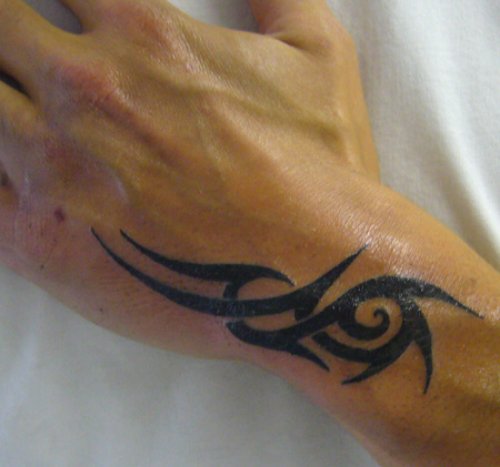Amazing Black Tribal Arm Tattoo For Men