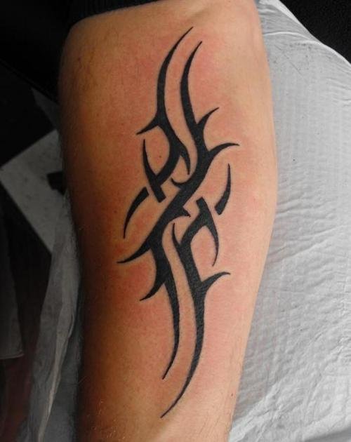 Unique Black Tribal Tattoo On Left Arm