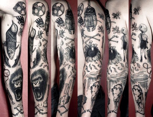 Grey Ink Flowers And Gorilla Head Tattoo On Arm