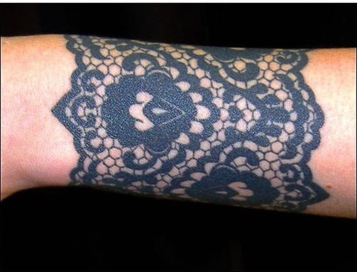 Black Ink Design Arm Tattoo