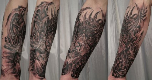 Grey Ink Tribal Left Arm Tattoo