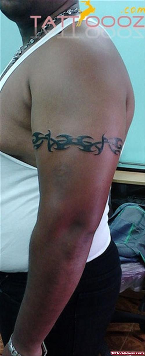 Black Ink Tribal Armband Tattoo On Left Bicep