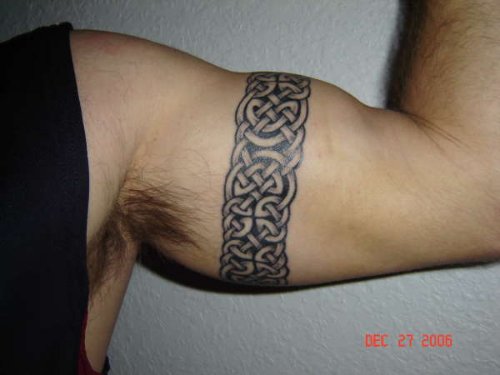 Black Ink Celtic Armband Tattoo On Left Muscles