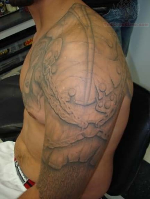 Grey Ink Armor Tattoo On Left Shoulder