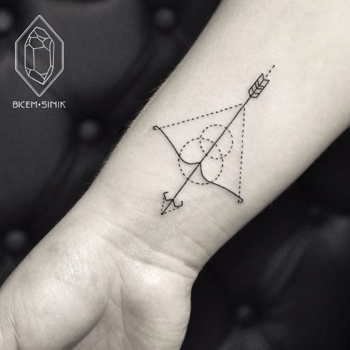 Dotwork Minimal Bow And Arrow Tattoo On Wrist