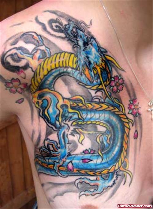 Blue Ink Asian Dragon Tattoo On Man Chest