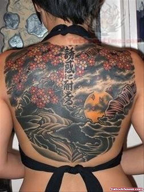 Attractive Colored Asian Tattoo On Girl Upperback