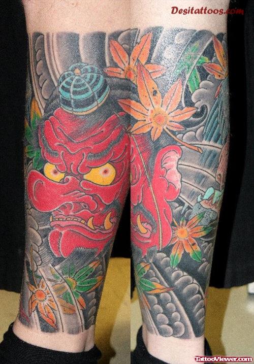 Red Ink Asian Tattoo On Leg