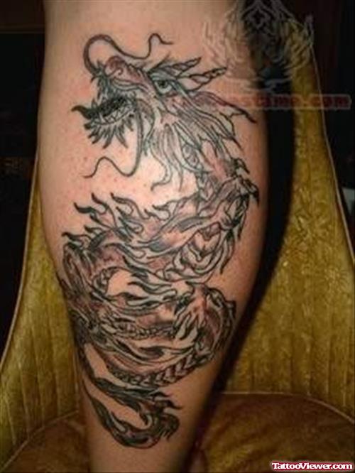 Grey Ink Dragon Asian Tattoo On Back Leg