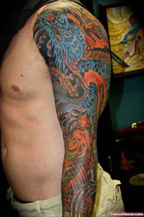 Attractive Colored Asian Tattoo On Man Left Sleeve