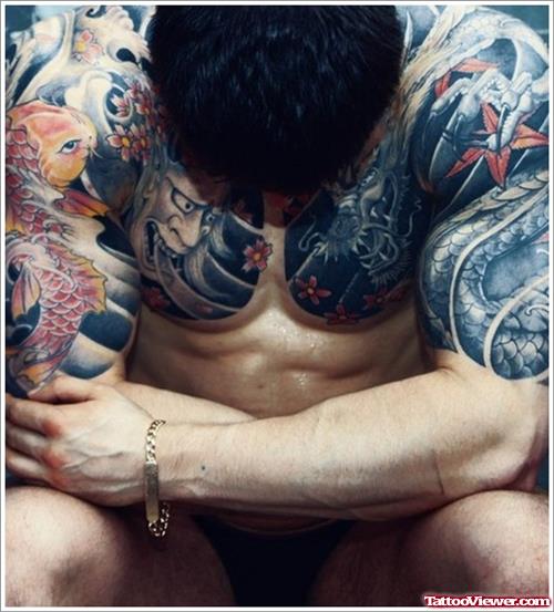 Asian Tattoo On Man Chest And Half Sleeve