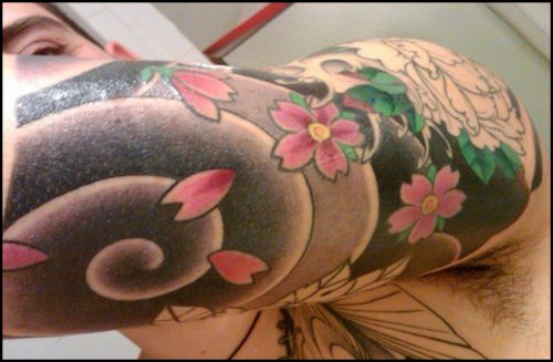 Colored Asian Tattoo On Left Sleeve
