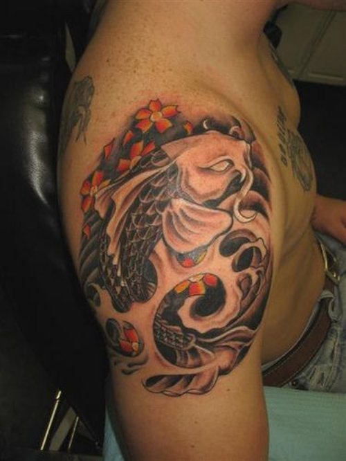 Colored Asian Fish Tattoo On Right Shoulder