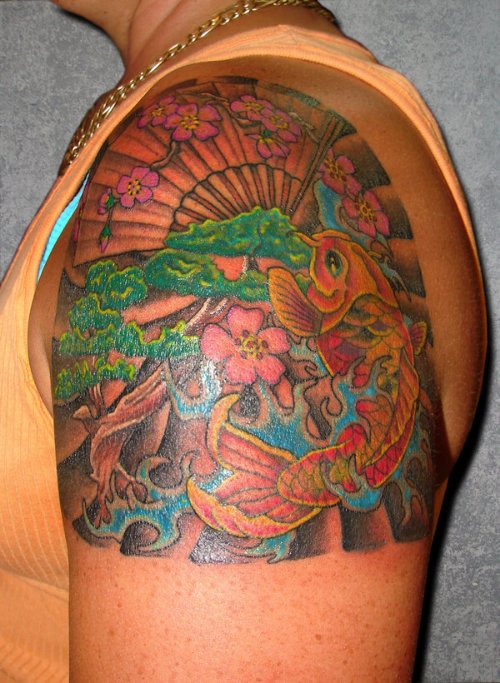 Colored Ink Asian Tattoo On Man Left Shoulder