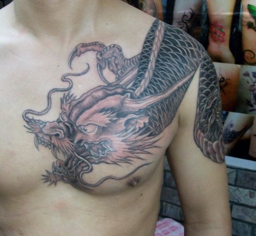 Grey Ink Asian Dragon Tattoo On Man Chest
