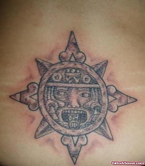 Grey Ink Aztec Sun Tattoo On Lowerback