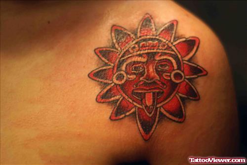Red Aztec Sun Tattoo On Left Shoulder