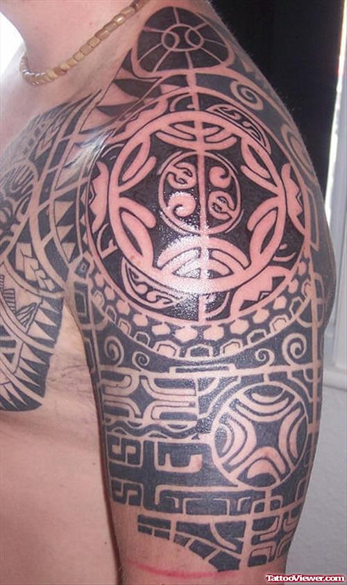 Man Aztec Tattoo On Chest And Left Half Sleeve