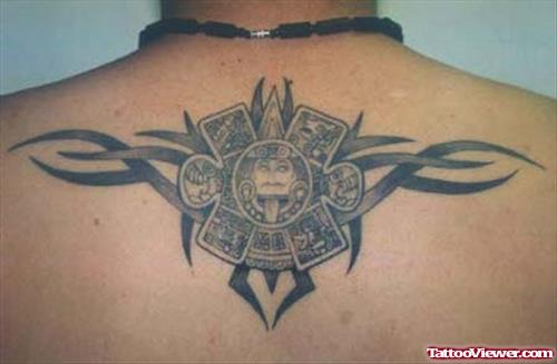 Grey Ink Tribal And Aztec Sun Tattoo On Upperback