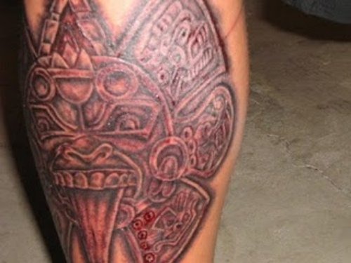Red Ink Aztec Tattoo On Leg