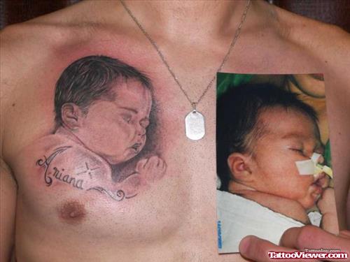 Sleeping Baby Tattoo On Man Chest