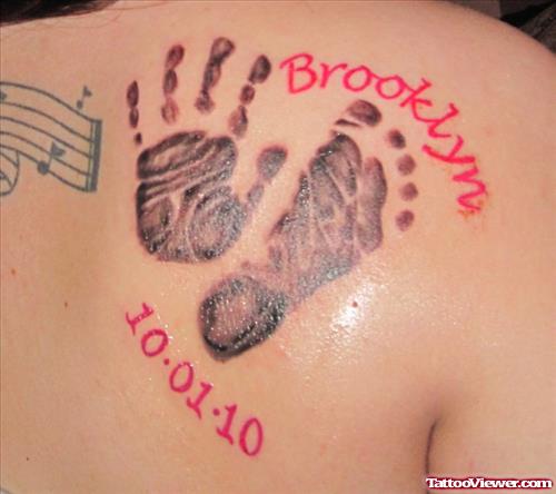 Memorial Baby Hand Print And Foot Print Tattoo On Back