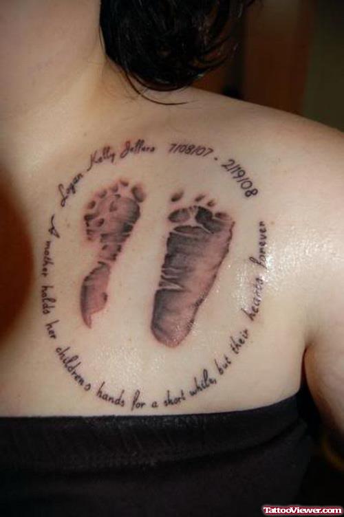 Grey Ink Baby Footprints Tattoo On Girl Chest
