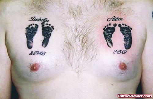 Black Ink Footprints Tattoos On Man Chest