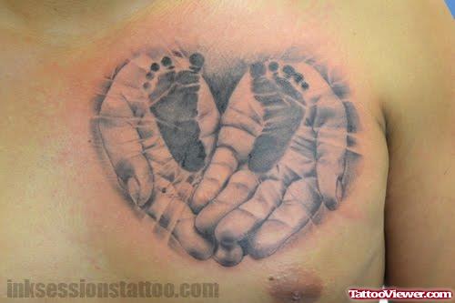 Baby Footprints On Hands Tattoo On Chest