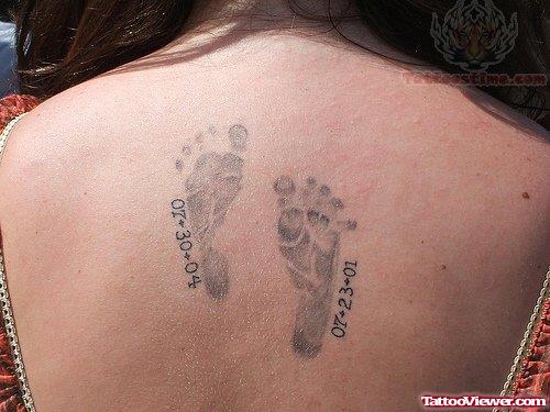 Attractive Memorial Baby Footprints Tattoo On Back