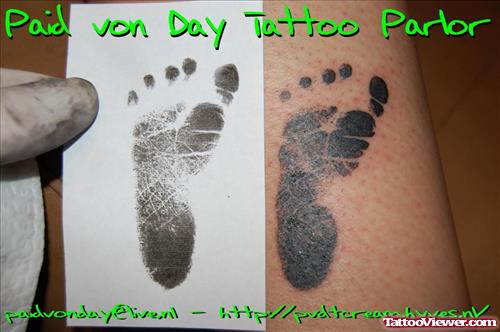 Black Ink Baby Footprint Tattoo