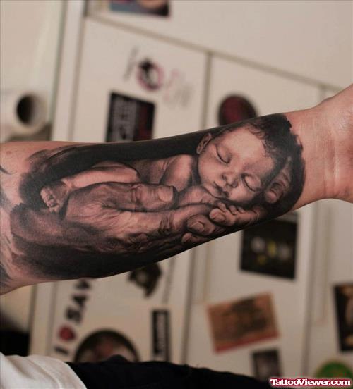 Dark Ink Baby Tattoo On Left Arm