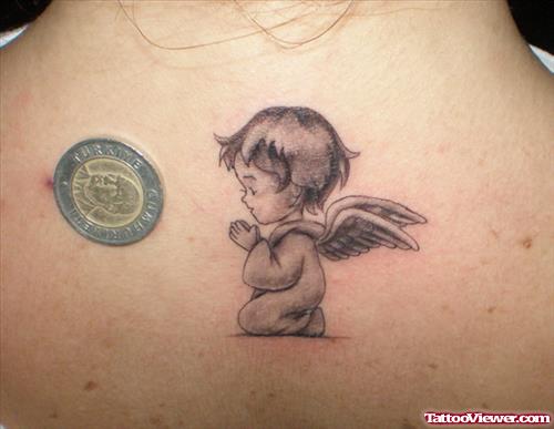 Grey Ink Baby Angel Tattoo On Upperback