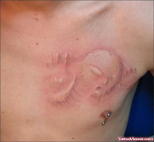 Baby Alien Ghost Implant Tattoo On Chest