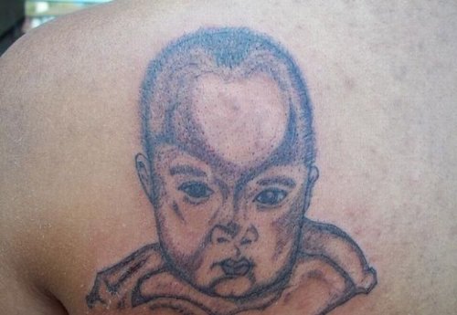 Grey Ink Baby Tattoo On Left Back Shoulder