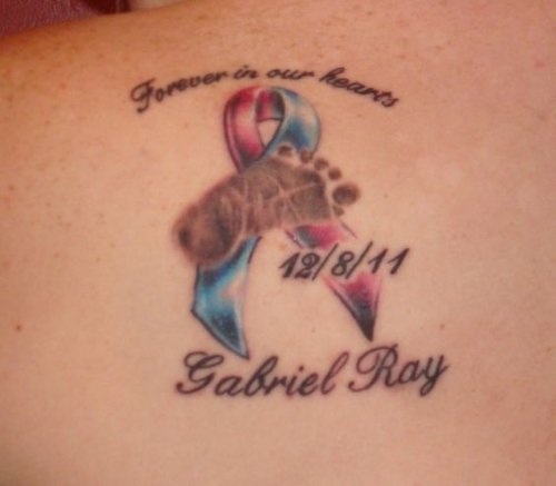 Memorial Baby Footprint With Memorial Date Tattoo On Back
