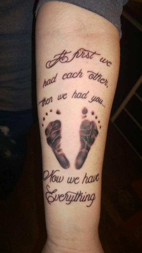 Cute Baby Foot Prints Tattoo On Left Forearm