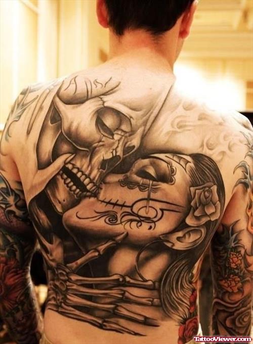 Grey Ink Skull And Dia De Los Muertos Kissing Tattoo On Back