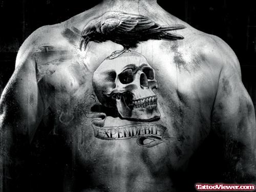 Crow Sitting On Skull Back Tattoo For Men