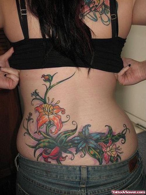 Colored Lily Flowers Back Tattoo For Girls